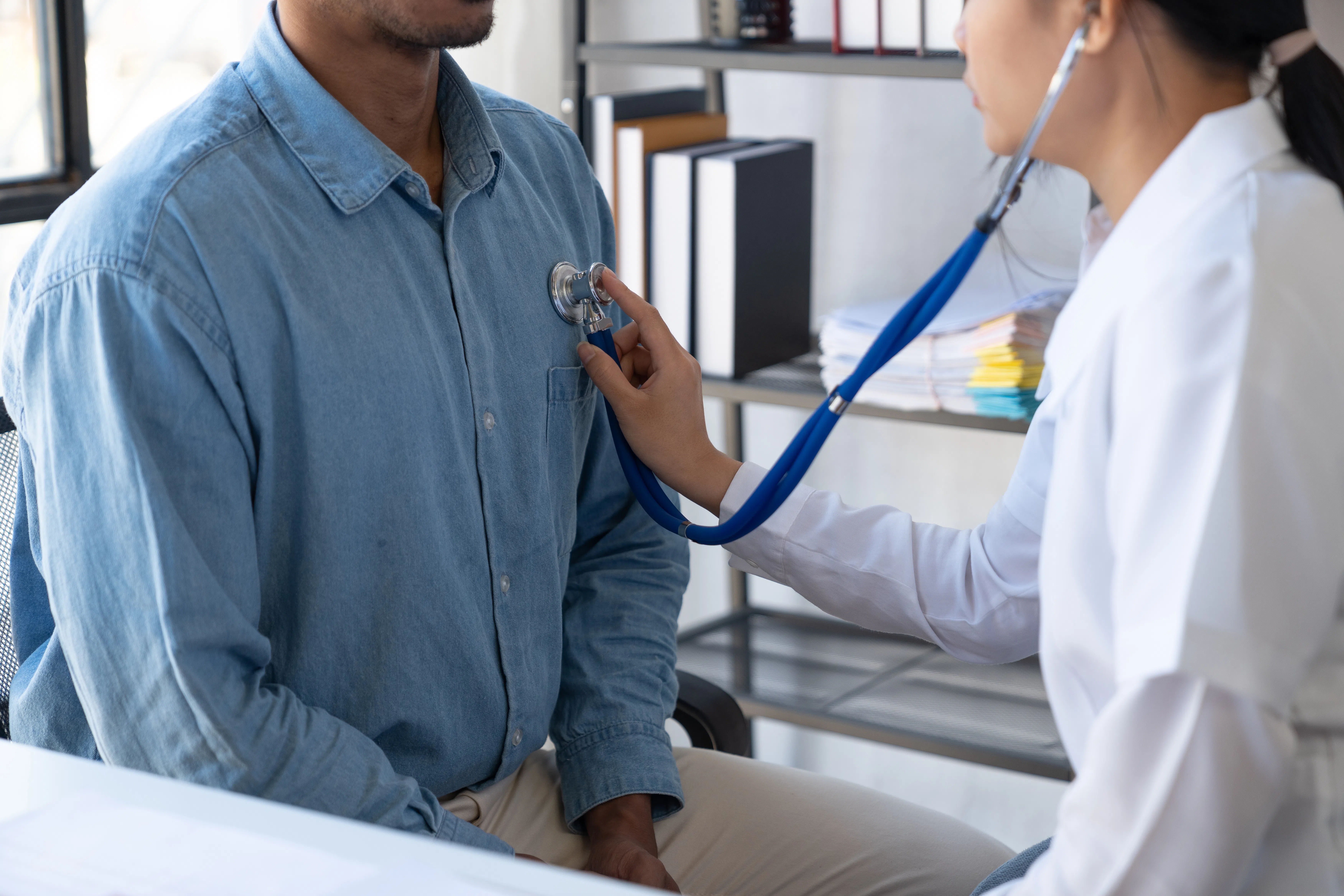 Doctor reviewing preventive healthcare assessment with patient